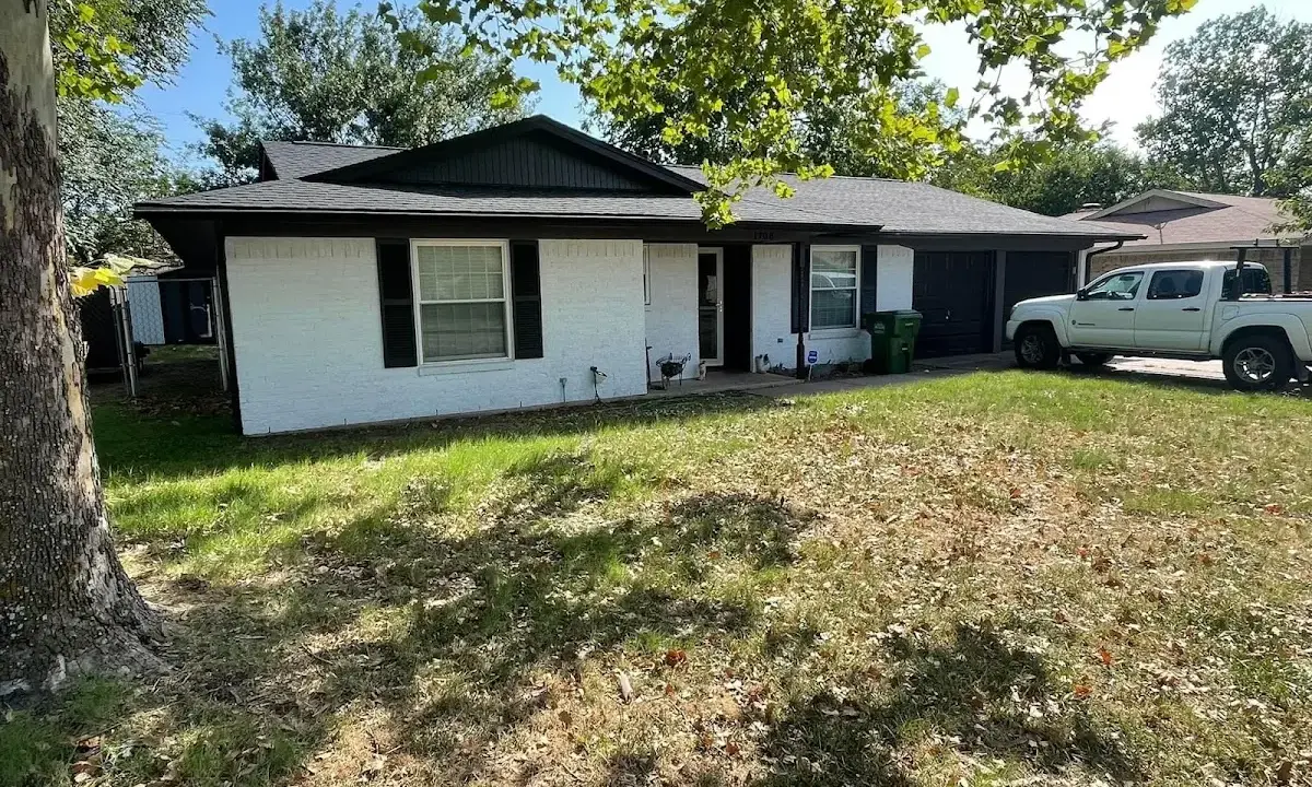 Professional roofing crew working on a residential roof in Santa Barbara